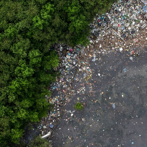 This aerial view shows the littered shore of a water channel that flows into the Guanabara Bay in Rio de Janeiro, Brazil, March 23, 2015. (Photo by Felipe Dana/AP)