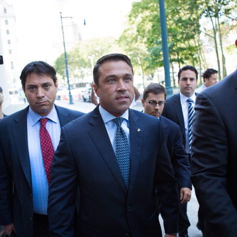 Former U.S. Rep. Michael Grimm (C) arrives ahead of his sentencing at federal court in Brooklyn, N.Y. (Photo by Kevin Hagen/AP).