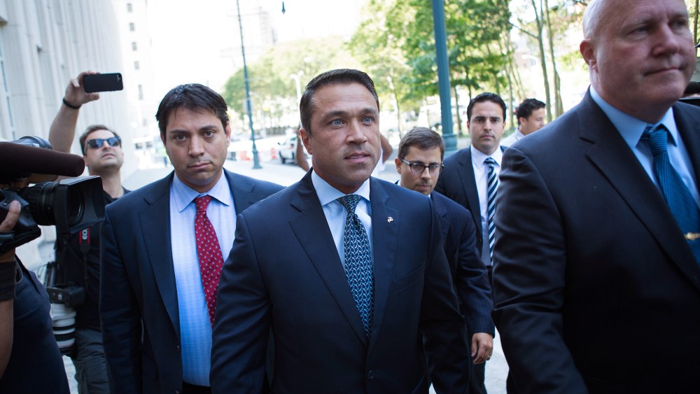Former U.S. Rep. Michael Grimm (C) arrives ahead of his sentencing at federal court in Brooklyn, N.Y. (Photo by Kevin Hagen/AP).