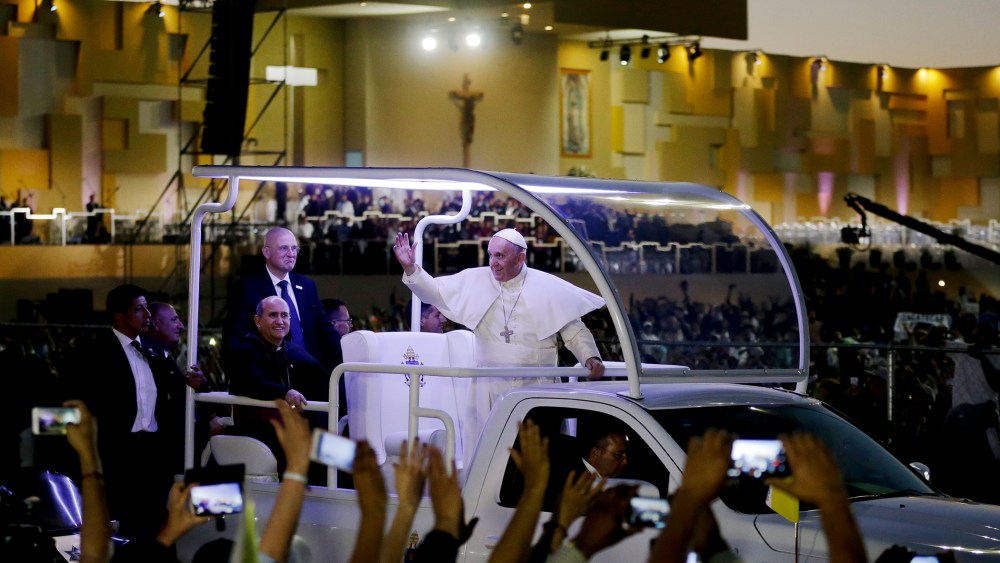 Pope Francis waves from his popemobile as he leaves the fairgrounds in Ciudad Juarez, Mexico, Feb. 17, 2016, where he celebrated an outdoor Mass. (Photo by Gregory Bull/Reuters)