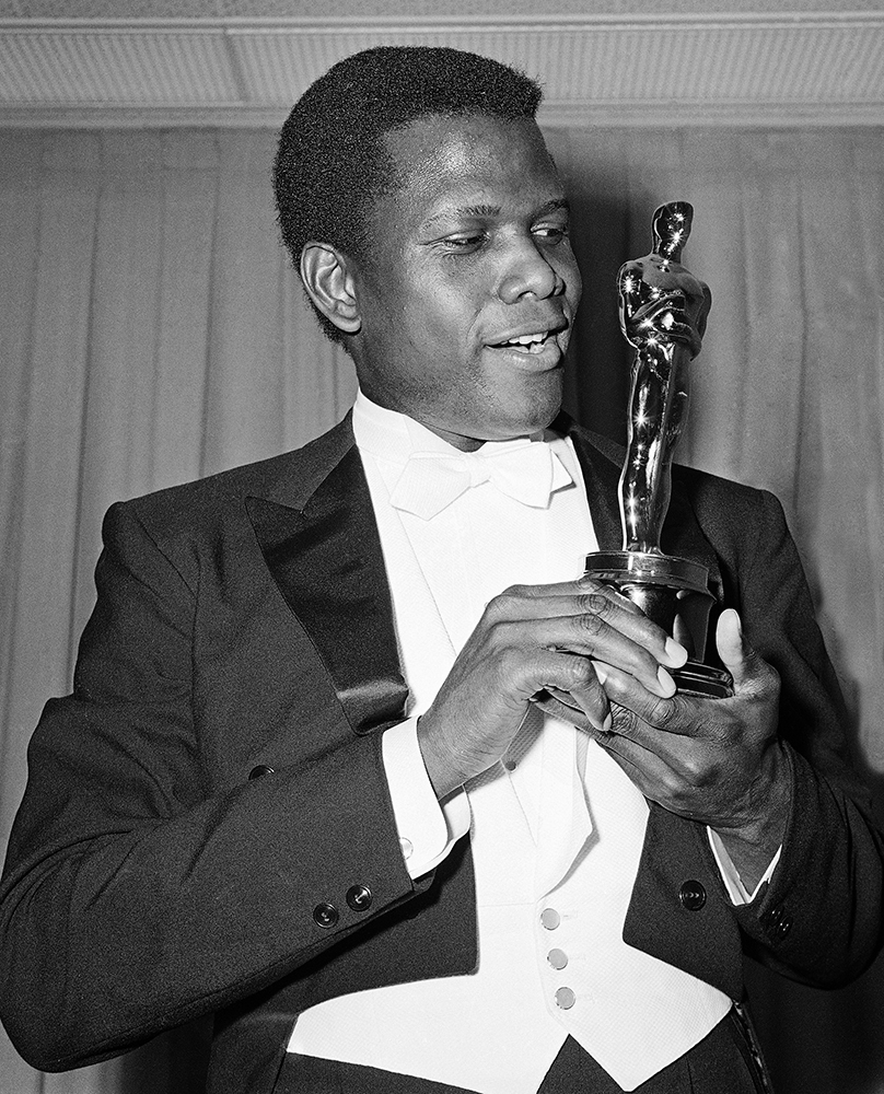 Actor Sidney Poitier is photographed with his Oscar statuette at the 36th Annual Academy Awards in Santa Monica, Calif. on April 13, 1964. He won Best Actor for his role in 