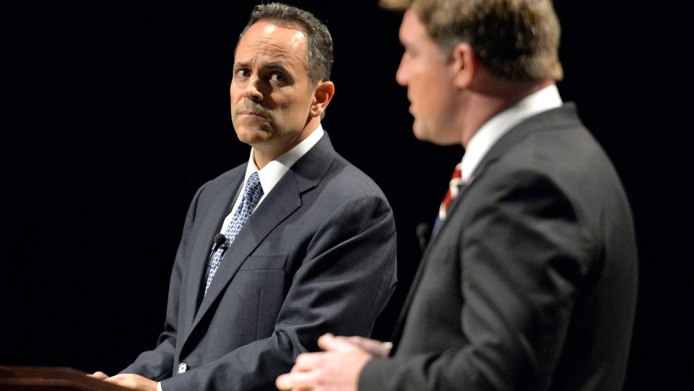 Kentucky Republican gubernatorial candidate Matt Bevin, left, looks on as Democratic candidate Jack Conway responds to a question during the League of Women Voters debate, Oct. 25, 2015, in Richmond, Ky. (Photo by Timothy D. Easley/AP)