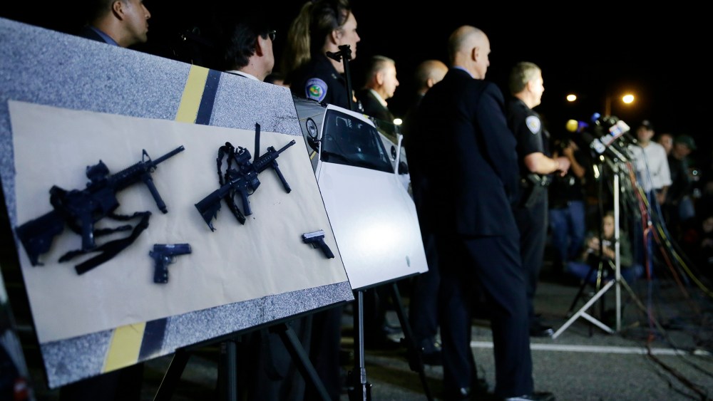 Police crime photos are displayed during a press conference near the site of yesterday's mass shooting on Dec. 3, 2015 in San Bernardino, Calif. (Photo by Chris Carlson/AP)