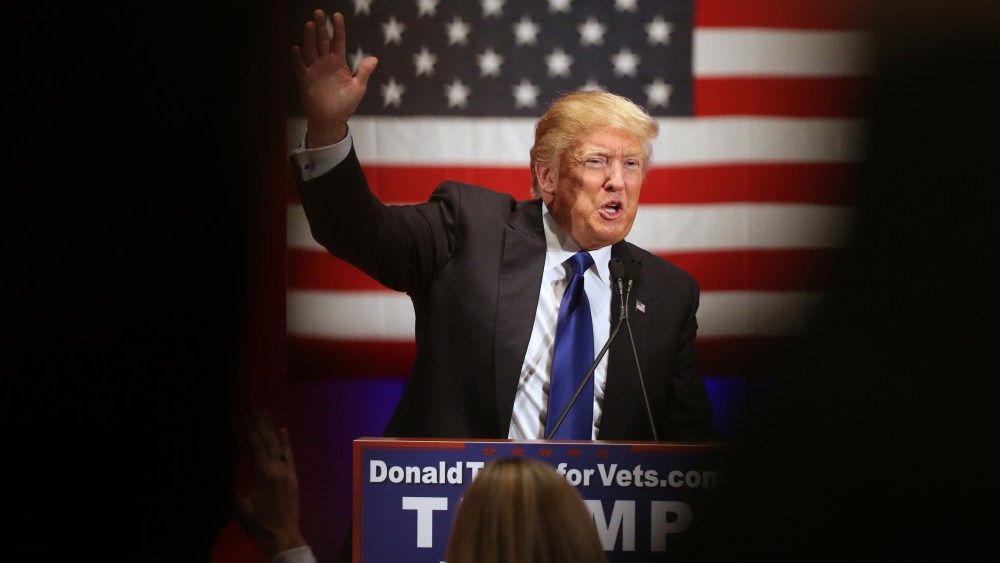 Republican presidential candidate Donald Trump waves tot the crowd at a event at Drake University in Des Moines, Iowa on Jan. 28, 2016. (Photo by Andrew Harnik/AP)