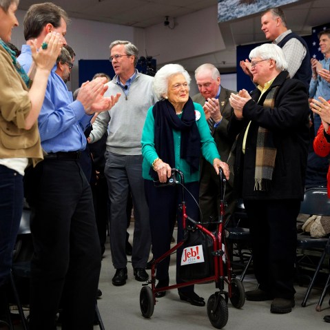 People stand and applaud as Republican presidential candidate and former Florida Gov. Jeb Bush arrives with his mother Barbara Bush to a town hall meeting in Derry, N.H., Feb. 4, 2016. (Photo by Jacquelyn Martin/AP)