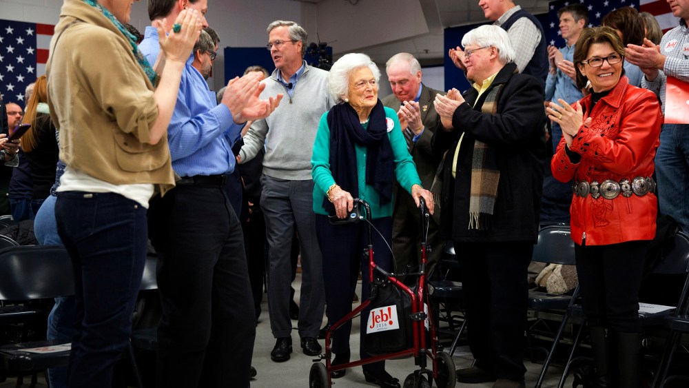 People stand and applaud as Republican presidential candidate and former Florida Gov. Jeb Bush arrives with his mother Barbara Bush to a town hall meeting in Derry, N.H., Feb. 4, 2016. (Photo by Jacquelyn Martin/AP)