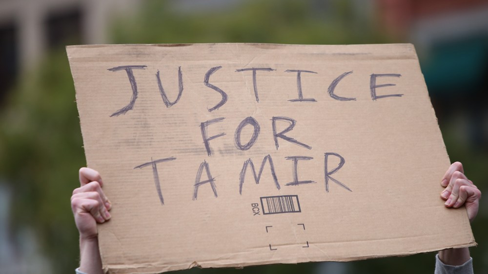 A "Justice for Tamir" sign is held aloft on Nov. 22, 2015. (Photo by Andy Katz/Pacific Press/Sipa/AP)