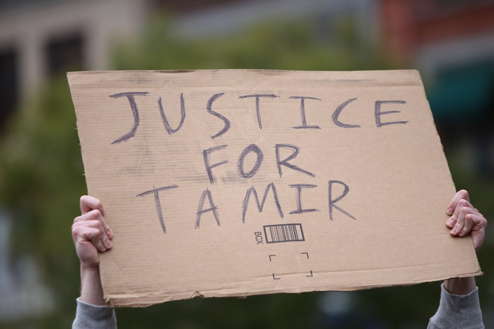 A "Justice for Tamir" sign is held aloft on Nov. 22, 2015. (Photo by Andy Katz/Pacific Press/Sipa/AP)