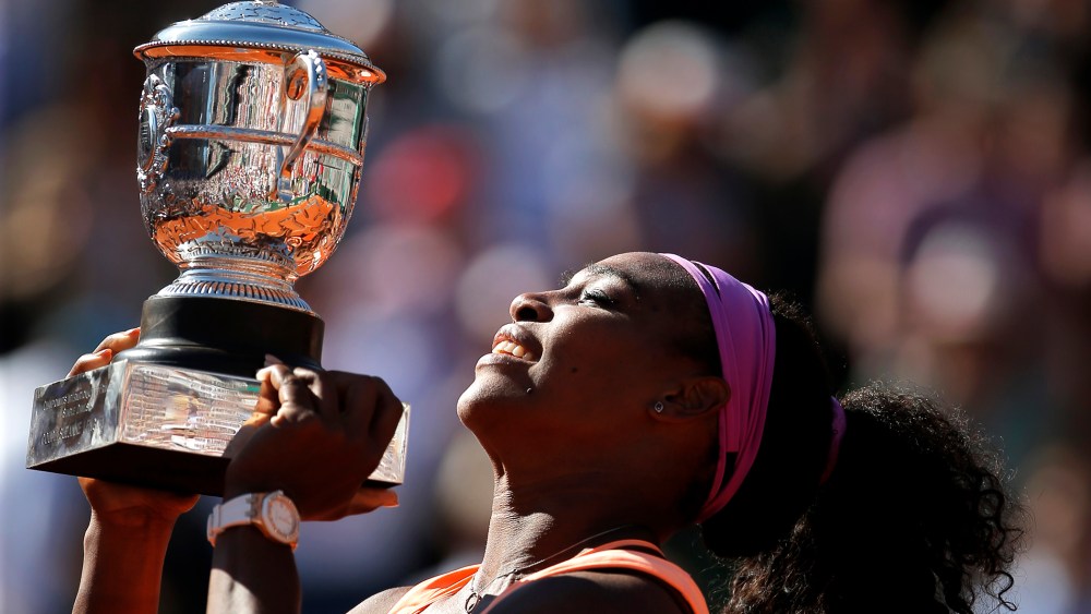 Serena Williams of the U.S holds the cup after defeating Lucie Safarova of the Czech Republic during their final match of the French Open tennis tournament at the Roland Garros stadium, June 6, 2015 in Paris. (Photo by Francois Mori/AP)