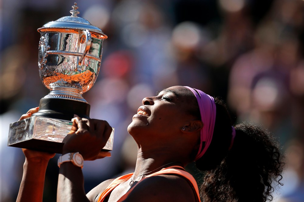 Serena Williams of the U.S holds the cup after defeating Lucie Safarova of the Czech Republic during their final match of the French Open tennis tournament at the Roland Garros stadium, June 6, 2015 in Paris. (Photo by Francois Mori/AP)
