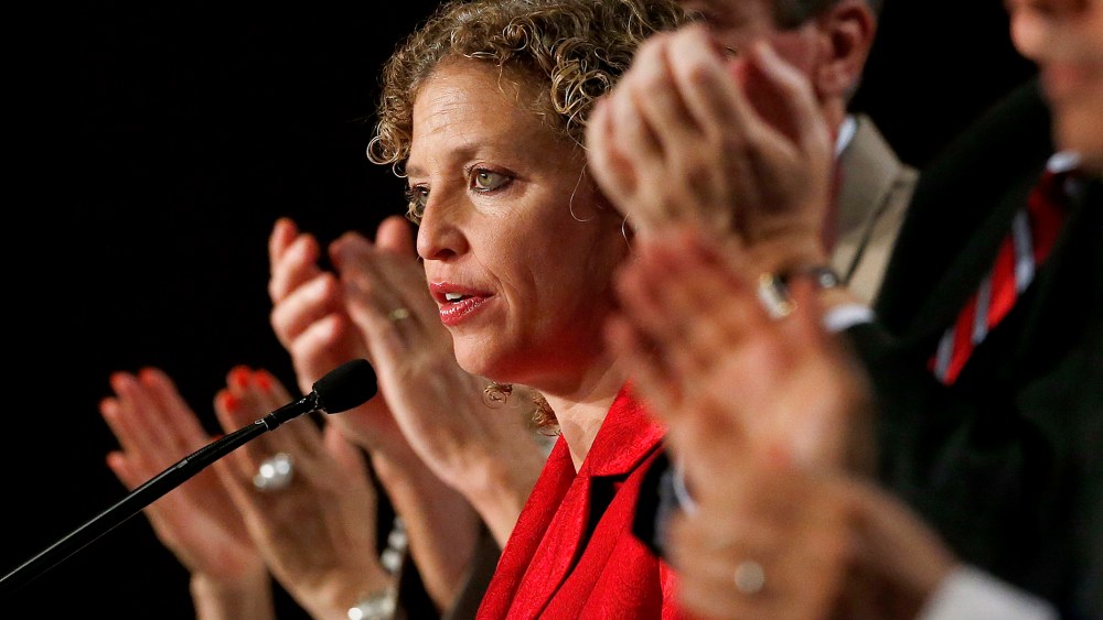 During a standing ovation, Democratic National Committee chair, Rep. Debbie Wasserman Schultz, D-Florida, speaks to party members during their summer meeting on, Aug. 23, 2013, in Scottsdale, Ariz. (Photo by Ross D. Franklin/AP)