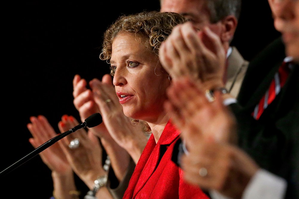 During a standing ovation, Democratic National Committee chair, Rep. Debbie Wasserman Schultz, D-Florida, speaks to party members during their summer meeting on, Aug. 23, 2013, in Scottsdale, Ariz. (Photo by Ross D. Franklin/AP)