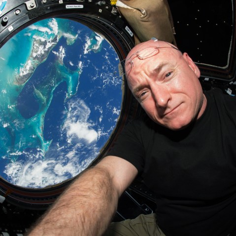 This July 12, 2015 photo made available by NASA, astronaut Scott Kelly poses for a selfie photo in the "Cupola" of the International Space Station. (Photo by Scott Kelly/NASA/AP)
