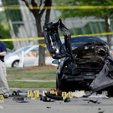 In this May 4, 2015 file photo, FBI crime scene investigators document evidence outside the Curtis Culwell Center in Garland, Texas. (Photo by Brandon Wade/AP)