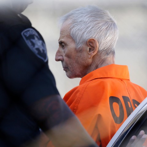 Robert Durst is escorted into Orleans Parish Prison after his arraignment in Orleans Parish Criminal District Court in New Orleans, March 17, 2015. (Photo by Gerald Herbert/AP)
