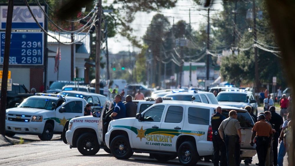Police gather at the scene of a shooting in Sunset, La. on Aug. 26, 2015. (Photo by Paul Kieu/The Daily Advertiser/AP)