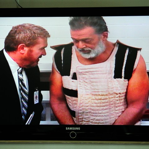 Colorado Springs shooting suspect Robert Dear appears via video before Judge Gilbert Martinez, with public defender Dan King, at the El Paso County Criminal Justice Center, Colo., Nov. 30, 2015. (Photo by Daniel Owen/Pool/AP)