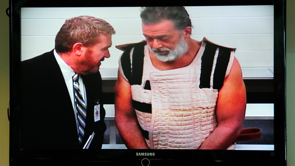 Colorado Springs shooting suspect Robert Dear appears via video before Judge Gilbert Martinez, with public defender Dan King, at the El Paso County Criminal Justice Center, Colo., Nov. 30, 2015. (Photo by Daniel Owen/Pool/AP)