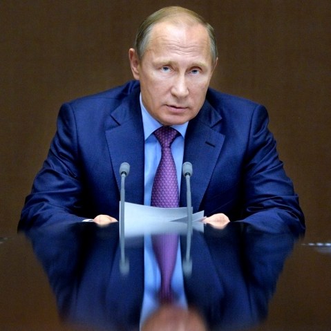 In this file photo, Russian President Vladimir Putin chairs a meeting with defense officials in the Black Sea resort of Sochi, Russia. (Photo by Alexei Druzhinin/Sputnik/Kremlin/Pool/AP)