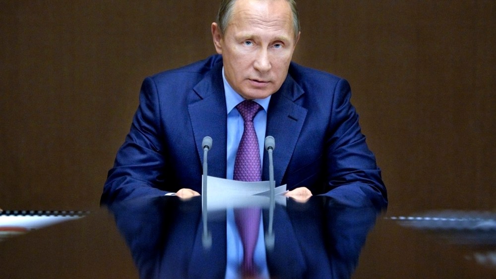In this file photo, Russian President Vladimir Putin chairs a meeting with defense officials in the Black Sea resort of Sochi, Russia. (Photo by Alexei Druzhinin/Sputnik/Kremlin/Pool/AP)