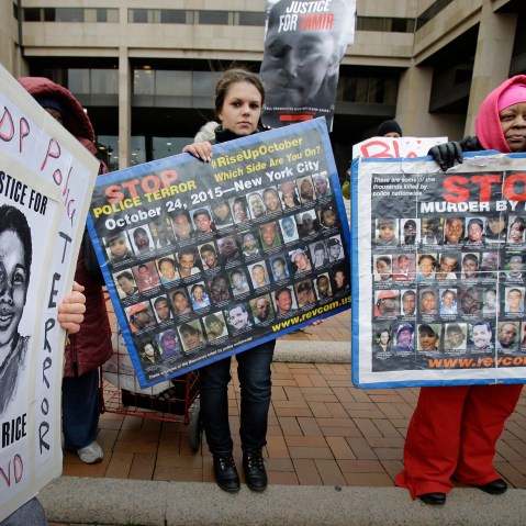 People protest outside the Cuyahoga County Justice Center, Tuesday, Dec. 29, 2015, in Cleveland. (Photo by Tony Dejak/AP)
