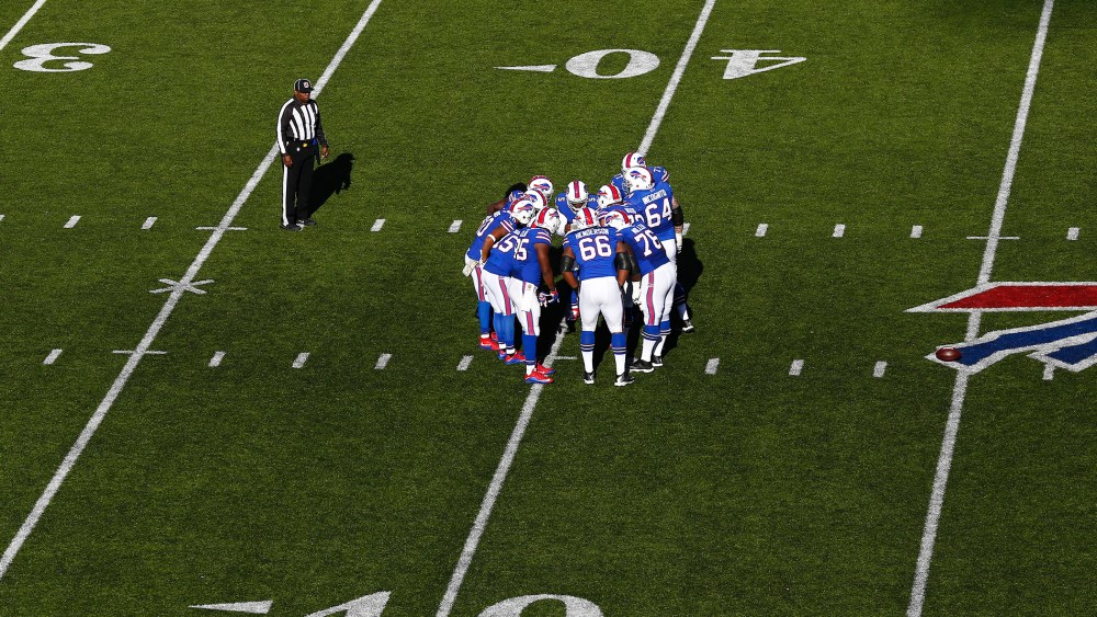 The Buffalo Bills huddle during an NFL football game against the Miami Dolphins at Ralph Wilson Stadium on Sunday, Nov. 8, 2015 in Orchard Park, N.Y. (Photo by Aaron M. Sprecher/AP)