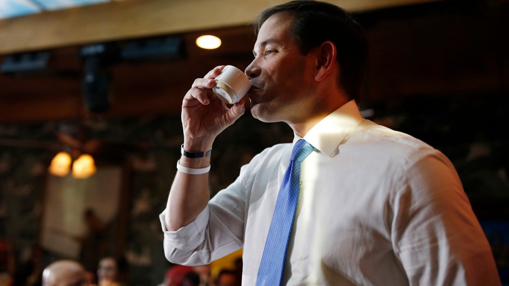 Republican presidential candidate Sen. Marco Rubio, R-Fla., enjoys a coffee while speaking at an event at a restaurant, Oct. 9, 2015, in Las Vegas. (Photo by John Locher/AP)