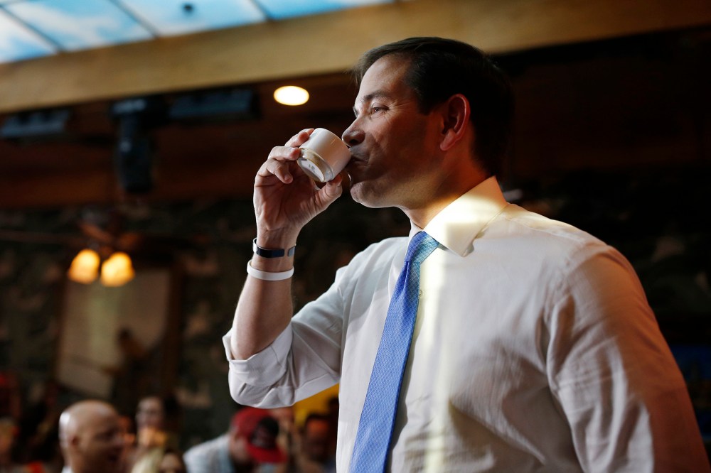 Republican presidential candidate Sen. Marco Rubio, R-Fla., enjoys a coffee while speaking at an event at a restaurant, Oct. 9, 2015, in Las Vegas. (Photo by John Locher/AP)