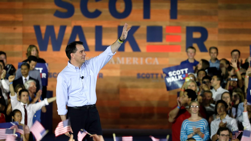 Wisconsin Gov. Scott Walker waves to supporters as he announces he is running for the 2016 Republican presidential nomination at the Waukesha County Expo Center on July 13, 2015, in Waukesha, Wis. (Photo by Morry Gash/AP)