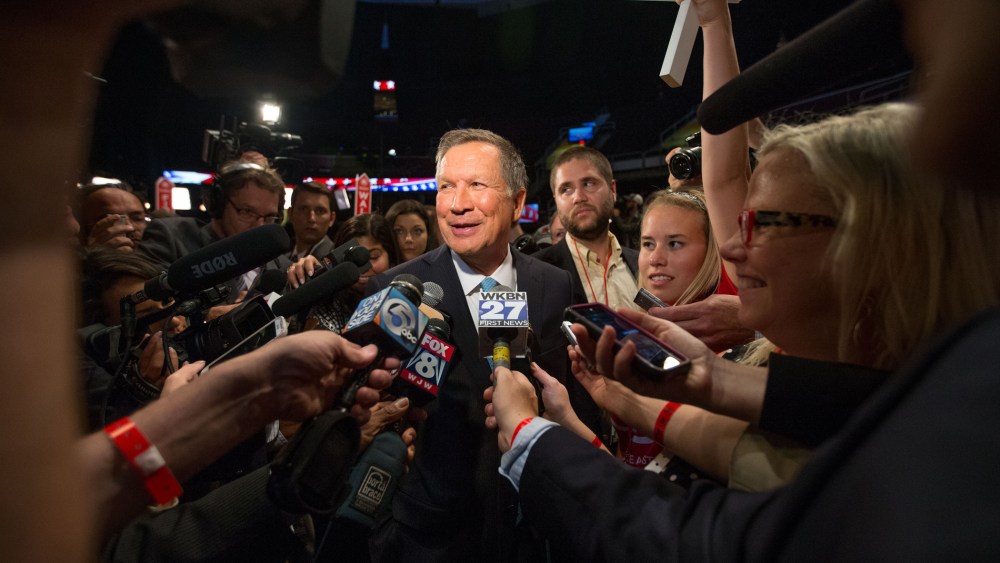 Republican presidential candidate Ohio Gov. John Kasich speaks to members of the media in the spin room following the first Republican presidential debate at the Quicken Loans Arena, Aug. 6, 2015, in Cleveland. (Photo by Andrew Harnik/AP)