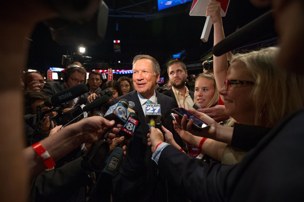Republican presidential candidate Ohio Gov. John Kasich speaks to members of the media in the spin room following the first Republican presidential debate at the Quicken Loans Arena, Aug. 6, 2015, in Cleveland. (Photo by Andrew Harnik/AP)