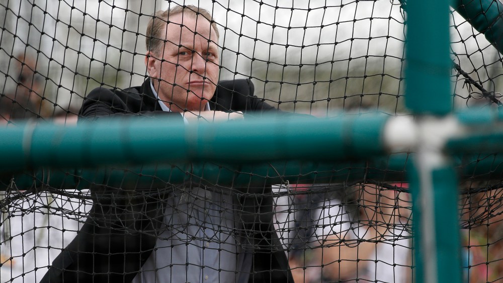 Baseball analyst and former Boston Red Sox pitcher Curt Schilling watches as infielders take batting practice at baseball spring training in Fort Myers Fla., Wednesday Feb. 25, 2015. (Photo by Tony Gutierrez/AP)