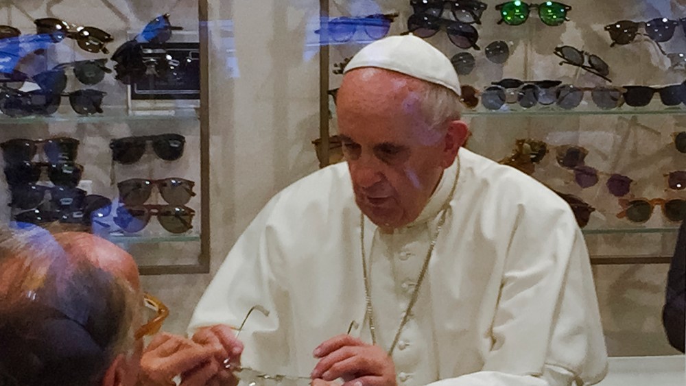 Pope Francis tries on a pair of spectacles in an eyeglass store in via del Babuino, in central Rome, Italy on  Sept. 3, 2015. (Photo by Daniel Soehne/AP)
