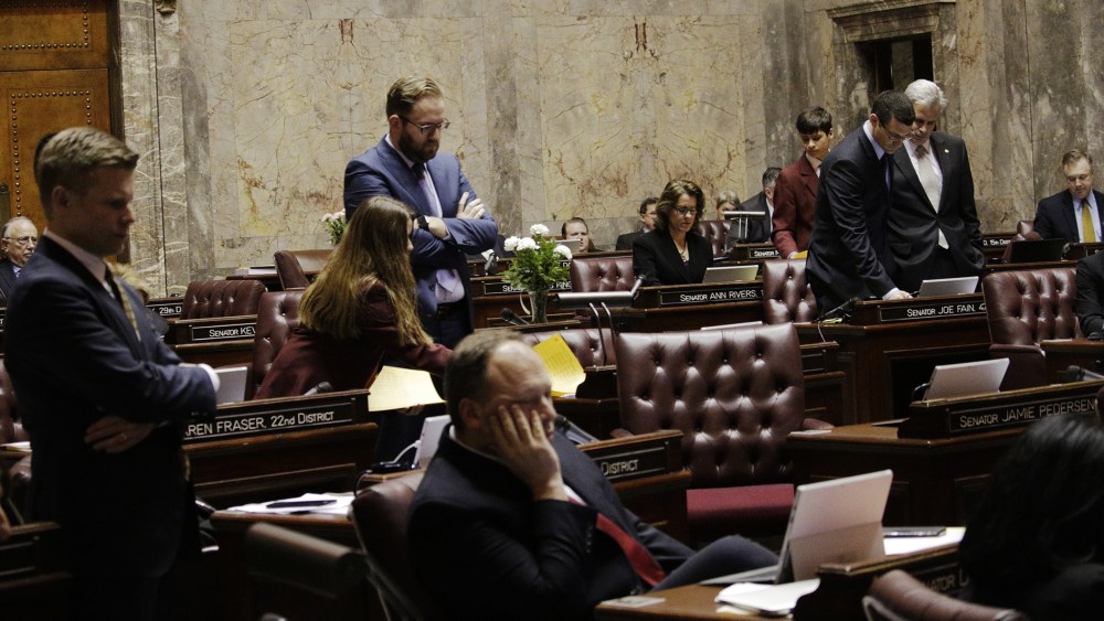 Senators watch the vote count on their computers on a bill barring transgender people to use gender-consistent bathrooms and locker rooms in public buildings, Feb. 10, 2016, in Olympia, Wash. (Photo by Rachel La Corte/AP)