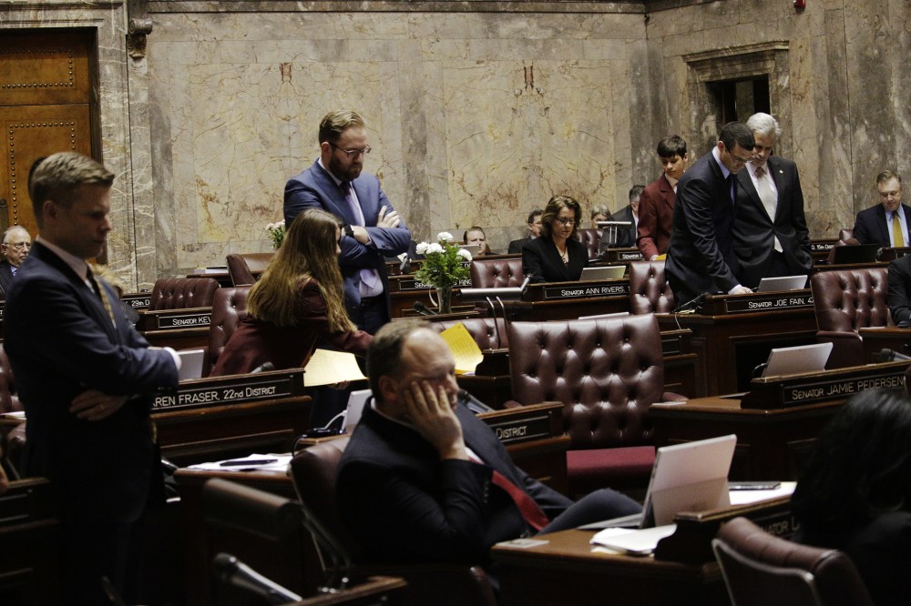 Senators watch the vote count on their computers on a bill barring transgender people to use gender-consistent bathrooms and locker rooms in public buildings, Feb. 10, 2016, in Olympia, Wash. (Photo by Rachel La Corte/AP)