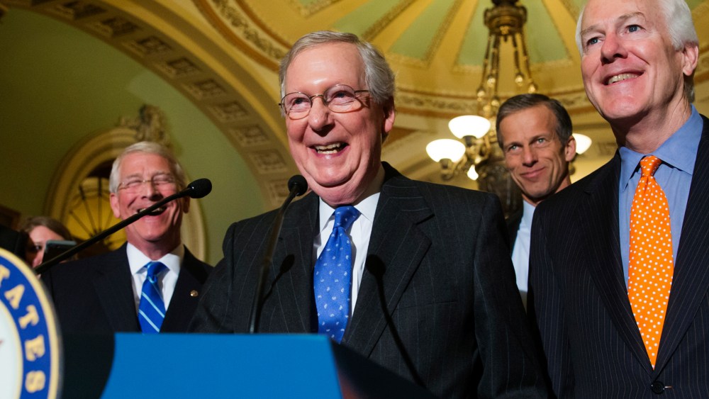 Senate Majority Leader Mitch McConnell, R-Ky., smiles as he speaks with reporters following a closed-door policy meeting on Capitol Hill in Washington, Feb. 23, 2016. (Photo by J. Scott Applewhite/AP)