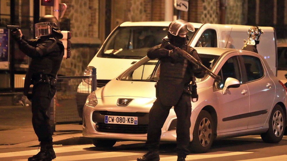 Police officers take up positions in Saint Denis, a northern suburb of Paris, Nov. 18, 2015. (Photo by Thibault Camus/AP)