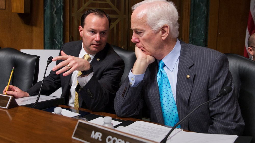 Sen. Mike Lee, R-Utah, and Sen. John Cornyn, R-Texas, confer at the start of a Senate Judiciary Committee hearing, on Capitol Hill in Washington, March 16, 2016. (Photo by J. Scott Applewhite/AP)