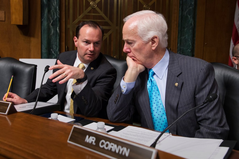 Sen. Mike Lee, R-Utah, and Sen. John Cornyn, R-Texas, confer at the start of a Senate Judiciary Committee hearing, on Capitol Hill in Washington, March 16, 2016. (Photo by J. Scott Applewhite/AP)