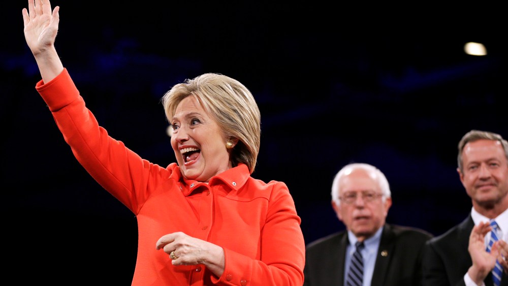 Democratic presidential candidate Hillary Rodham Clinton waves to supporters during the Iowa Democratic Party's Jefferson-Jackson Dinner, Oct. 24, 2015, in Des Moines, Iowa. (Photo by Charlie Neibergall/AP)