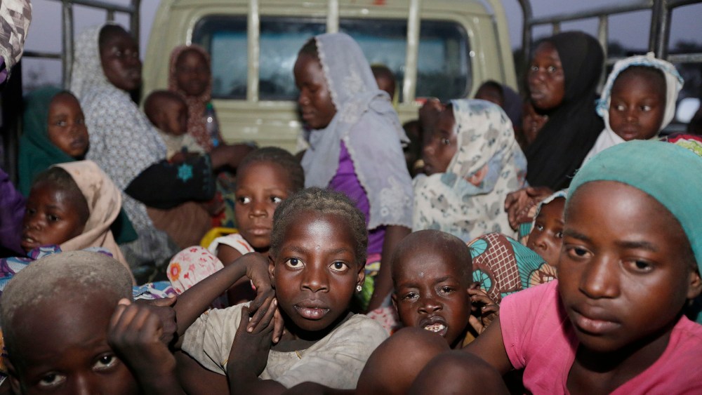 In this Saturday May 2, 2015 file photo, women and children rescued by Nigerian soldiers from Boko Haram at Sambisa forest arrive at a camp for the displaced people in Yola, Nigeria. (Photo by Sunday Alamba/AP)