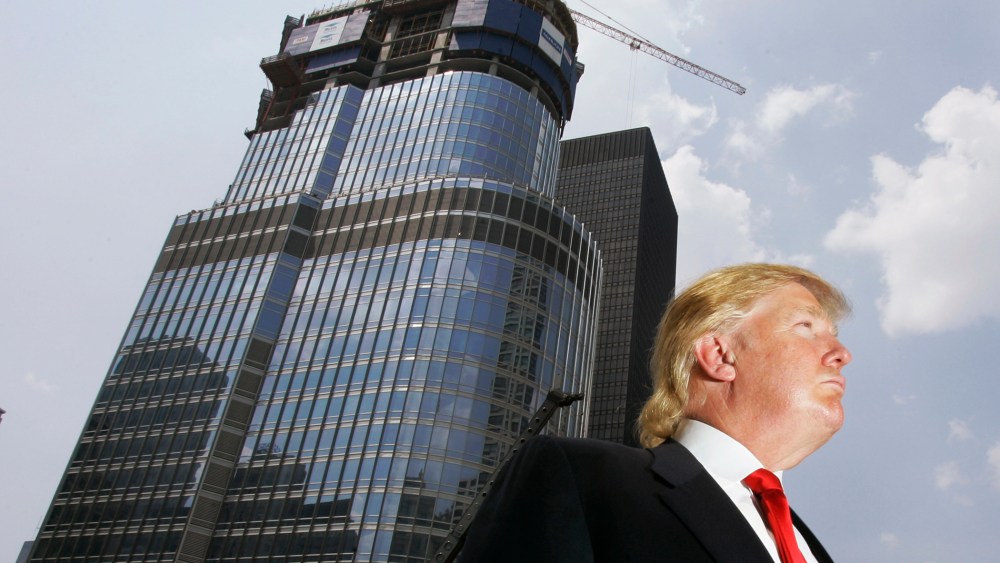Donald Trump is profiled against his 92-story Trump International Hotel & Tower during a news conference on construction progress in Chicago, Ill. on May 24, 2007. (Photo by Charles Rex Arbogast/AP)