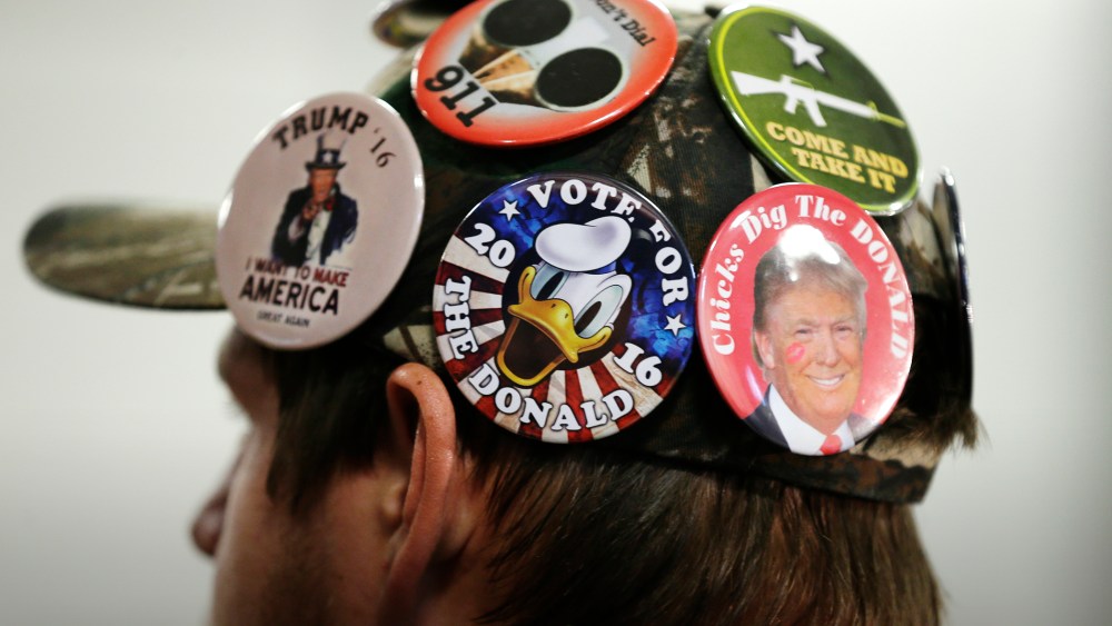 A supporter for Republican presidential candidate Donald Trump listens during a campaign rally, Dec. 5, 2015, in Davenport, Iowa. (Photo by Charlie Neibergall/AP)
