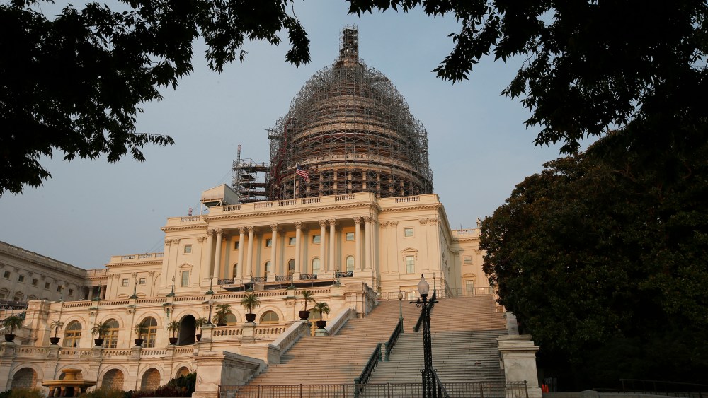 The west front of the U.S. Capitol is seen under repair Sept. 2, 2015 in Washington. (Photo by Alex Brandon/AP)
