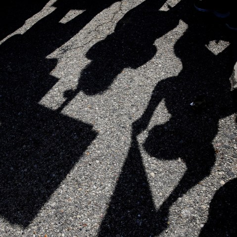 Donald Trump demonstrators casts shadows as they gather outside the Holiday Inn Express in Janesville, Wis., March 29, 2016. (Photo by Nam Y. Huh/AP)