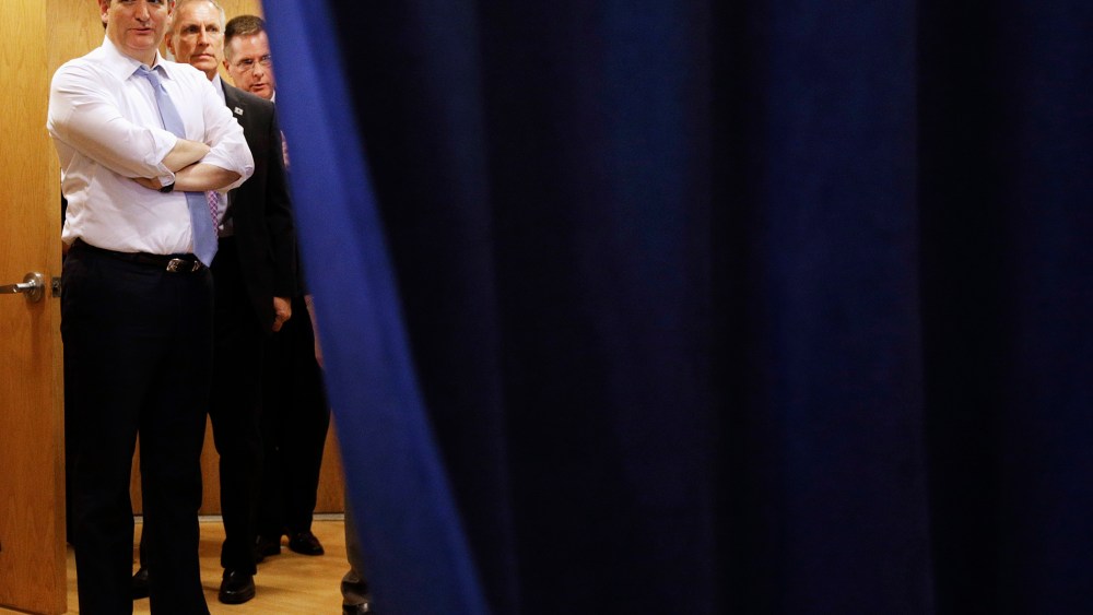 Republican presidential candidate, Sen. Ted Cruz, R-Texas, waits behind a curtain for his introduction at a rally in Towson, Md., April 18, 2016. (Photo by Patrick Semansky/AP)