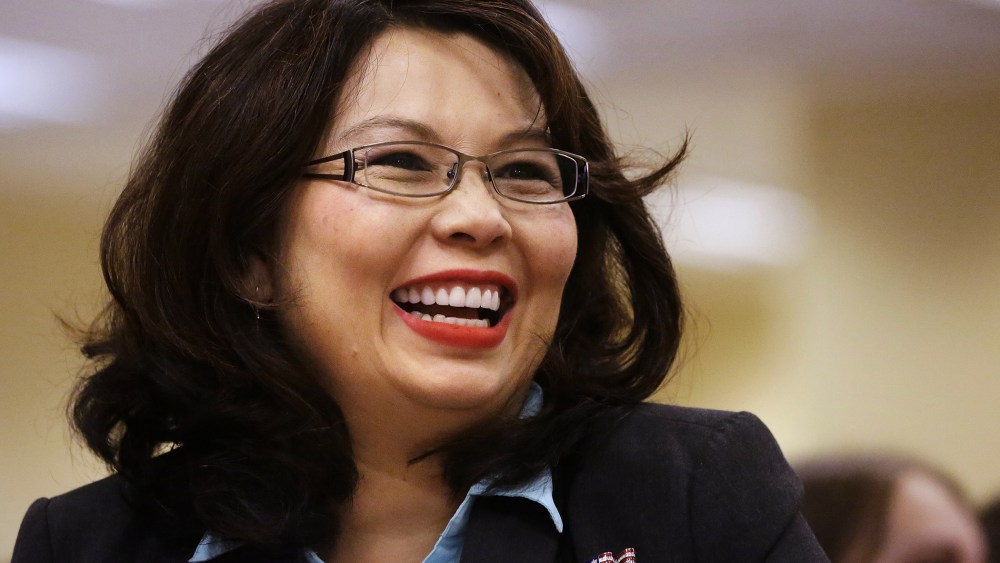 In this Aug. 13, 2014 file photo, Rep. Tammy Duckworth, D-Ill., acknowledges applause in Springfield, Ill. (Photo by Seth Perlman/AP)