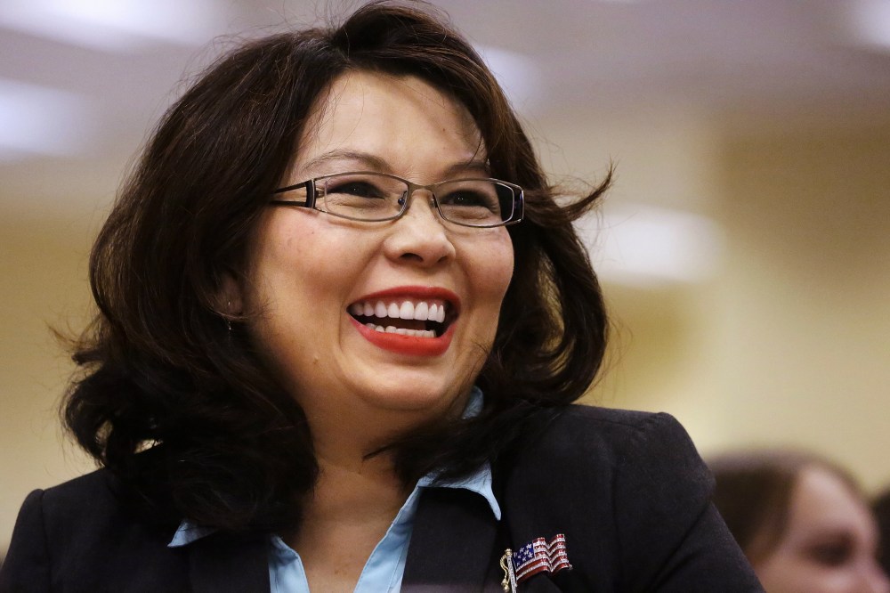 In this Aug. 13, 2014 file photo, Rep. Tammy Duckworth, D-Ill., acknowledges applause in Springfield, Ill. (Photo by Seth Perlman/AP)