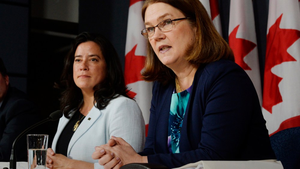 Canada's Health Minister Jane Philpott, right, speaks as Justice Minister Jody Wilson-Raybould listens at a news conference in Ottawa on April 14, 2016. (Photo by Adrian Wyld/The Canadian Press/AP)