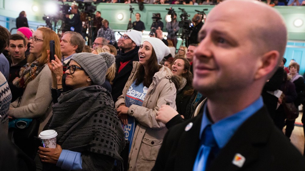 Attendees laugh as Democratic presidential candidate, Sen. Bernie Sanders, I-Vt. speaks during a campaign stop at Exeter Town Hall, Feb. 5, 2016, in Exeter, N.H. (Photo by John Minchillo/AP)